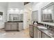 Well-lit bathroom with double sinks, granite countertops, and a neutral color palette at 750 Highview Ct, Woodstock, GA 30189