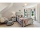 Cozy bedroom with a decorative chandelier, soft colors, and plush bedding at 750 Highview Ct, Woodstock, GA 30189
