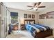 This bedroom features a ceiling fan, nice window and a closet at 750 Highview Ct, Woodstock, GA 30189