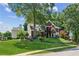 Beautiful two-story brick home with a well-manicured lawn, mature trees, and charming curb appeal at 750 Highview Ct, Woodstock, GA 30189