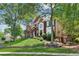 Picturesque brick home featuring a lush front lawn and attractive landscaping, enhancing its curb appeal at 750 Highview Ct, Woodstock, GA 30189