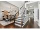 Inviting foyer with staircase, hardwood floors, and a view into the dining room at 750 Highview Ct, Woodstock, GA 30189