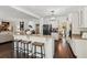 Stylish open kitchen features granite counters, stainless steel appliances and breakfast bar with stool seating at 750 Highview Ct, Woodstock, GA 30189