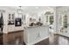 Bright and airy kitchen boasts stainless appliances, granite countertops and seamless access to living room at 750 Highview Ct, Woodstock, GA 30189