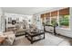 Inviting living room with large windows, hardwood floors, and seamless access to the modern kitchen at 750 Highview Ct, Woodstock, GA 30189