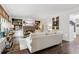 Bright living room features hardwood floors, stone fireplace, built-in shelving, and stylish decor at 750 Highview Ct, Woodstock, GA 30189