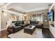 This living room features a comfortable sectional sofa and a view of the backyard at 750 Highview Ct, Woodstock, GA 30189