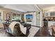 Open-concept living room features a media center and built-in wet bar with a beverage fridge at 750 Highview Ct, Woodstock, GA 30189