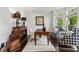 Well-lit home office with built-in shelving, a desk, and comfortable seating, perfect for remote work at 750 Highview Ct, Woodstock, GA 30189