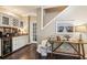 This wet bar features wine storage, granite counters, and a beverage fridge at 750 Highview Ct, Woodstock, GA 30189