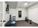 A home workout room features a ceiling fan, mounted TV, and mirrored closet at 750 Highview Ct, Woodstock, GA 30189