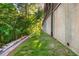Backyard view with well-maintained greenery, landscaping, and hardscaping at 1496 Shadowrock Dr, Marietta, GA 30062