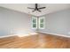 This bedroom is complete with hardwood floors and a ceiling fan at 1496 Shadowrock Dr, Marietta, GA 30062