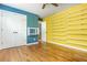 This bedroom features hardwood floors, unique shelving and natural light at 1496 Shadowrock Dr, Marietta, GA 30062