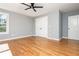 This bedroom features hardwood floors, two closets and a ceiling fan at 1496 Shadowrock Dr, Marietta, GA 30062