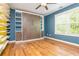 This blue bedroom offers a stylish built-in Murphy bed with shelving at 1496 Shadowrock Dr, Marietta, GA 30062