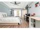 Bright bedroom featuring hardwood floors, recessed lights, ceiling fan, and a window for natural light at 1496 Shadowrock Dr, Marietta, GA 30062