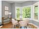 Cozy dining area features large windows and hardwood floors at 1496 Shadowrock Dr, Marietta, GA 30062