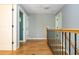 Upstairs hallway boasts hardwood floors and open doorways at 1496 Shadowrock Dr, Marietta, GA 30062