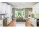 Bright kitchen with a kitchen island, white cabinets, and stainless steel appliances at 1496 Shadowrock Dr, Marietta, GA 30062