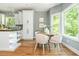 Bright kitchen featuring white cabinets, stainless steel appliances, and a breakfast area at 1496 Shadowrock Dr, Marietta, GA 30062