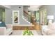 Open concept living room featuring hardwood floors and a staircase at 1496 Shadowrock Dr, Marietta, GA 30062