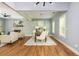 Spacious living room and dining area with fireplace, hardwood floors, neutral paint, and lots of natural light at 1496 Shadowrock Dr, Marietta, GA 30062