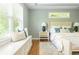 Beautiful main bedroom features a window bench and a decorative rug at 1496 Shadowrock Dr, Marietta, GA 30062