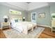 This main bedroom features stylish hardwood floors, tray ceilings and neutral walls at 1496 Shadowrock Dr, Marietta, GA 30062