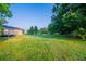 Expansive backyard featuring lush greenery, mature trees, and a charming deck, great for relaxation and outdoor fun at 2091 Moon Drive Sw, Conyers, GA 30094