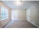 Bedroom with plush carpet, window, and closet at 2091 Moon Drive Sw, Conyers, GA 30094