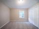 Spacious bedroom with plush carpet and a window for natural light at 2091 Moon Drive Sw, Conyers, GA 30094