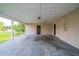 Covered patio area with a brick wall at 2091 Moon Drive Sw, Conyers, GA 30094