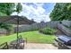 Fenced backyard with patio, landscaping, grill and patio furniture at 2908 Cottesford Se Way, Smyrna, GA 30080