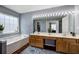 Spacious bathroom with double vanities, a large mirror with Hollywood lights, and a soaking tub at 2908 Cottesford Se Way, Smyrna, GA 30080