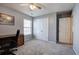 Bedroom featuring a desk, chair, and window with blinds providing ample natural light at 2908 Cottesford Se Way, Smyrna, GA 30080