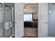 Bedroom view through double doors, showcasing carpet, ceiling fan, and natural light at 2908 Cottesford Se Way, Smyrna, GA 30080