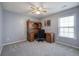 Bedroom with a ceiling fan, large desk, chair and natural light from the window with blinds at 2908 Cottesford Se Way, Smyrna, GA 30080
