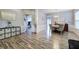 Open dining room with wainscoting, hard wood floors, and chandelier adjacent to hall at 2908 Cottesford Se Way, Smyrna, GA 30080