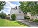Charming two-story home with a two-car garage, well-maintained lawn, and mature trees at 2908 Cottesford Se Way, Smyrna, GA 30080