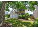 Traditional home featuring a manicured front lawn, two-car garage, and brick accents at 2908 Cottesford Se Way, Smyrna, GA 30080