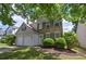 Charming two-story home with a manicured lawn, brick accents, gray shutters and a two-car garage at 2908 Cottesford Se Way, Smyrna, GA 30080