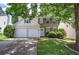 Charming two-story home with a manicured lawn, brick accents, gray shutters and a two-car garage at 2908 Cottesford Se Way, Smyrna, GA 30080