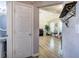 Hallway with powder room, piano, and wood floors, with decorative string lights at 2908 Cottesford Se Way, Smyrna, GA 30080