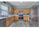 Bright kitchen features stainless steel appliances, light countertops and lots of cabinet space at 2908 Cottesford Se Way, Smyrna, GA 30080