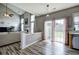 View from kitchen to living room with backyard access through sliding glass door at 2908 Cottesford Se Way, Smyrna, GA 30080