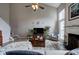 Living room with fireplace, ceiling fan and seamless access to staircase at 2908 Cottesford Se Way, Smyrna, GA 30080