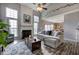 Living room with vaulted ceiling, fireplace, and seamless access to eat-in kitchen at 2908 Cottesford Se Way, Smyrna, GA 30080