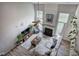 Bright living room featuring a fireplace, high ceilings, ceiling fan and large windows at 2908 Cottesford Se Way, Smyrna, GA 30080