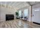 Living room with decorative string lights, piano, and wood floors near front door at 2908 Cottesford Se Way, Smyrna, GA 30080